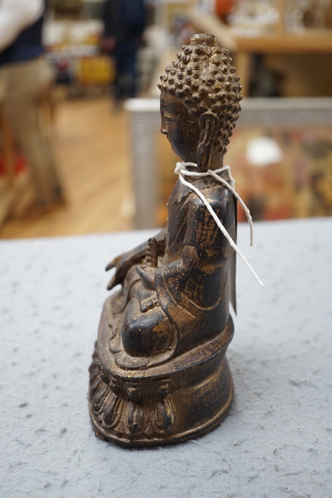 A Chinese gilt iron seated figure of Buddha, 19cm
